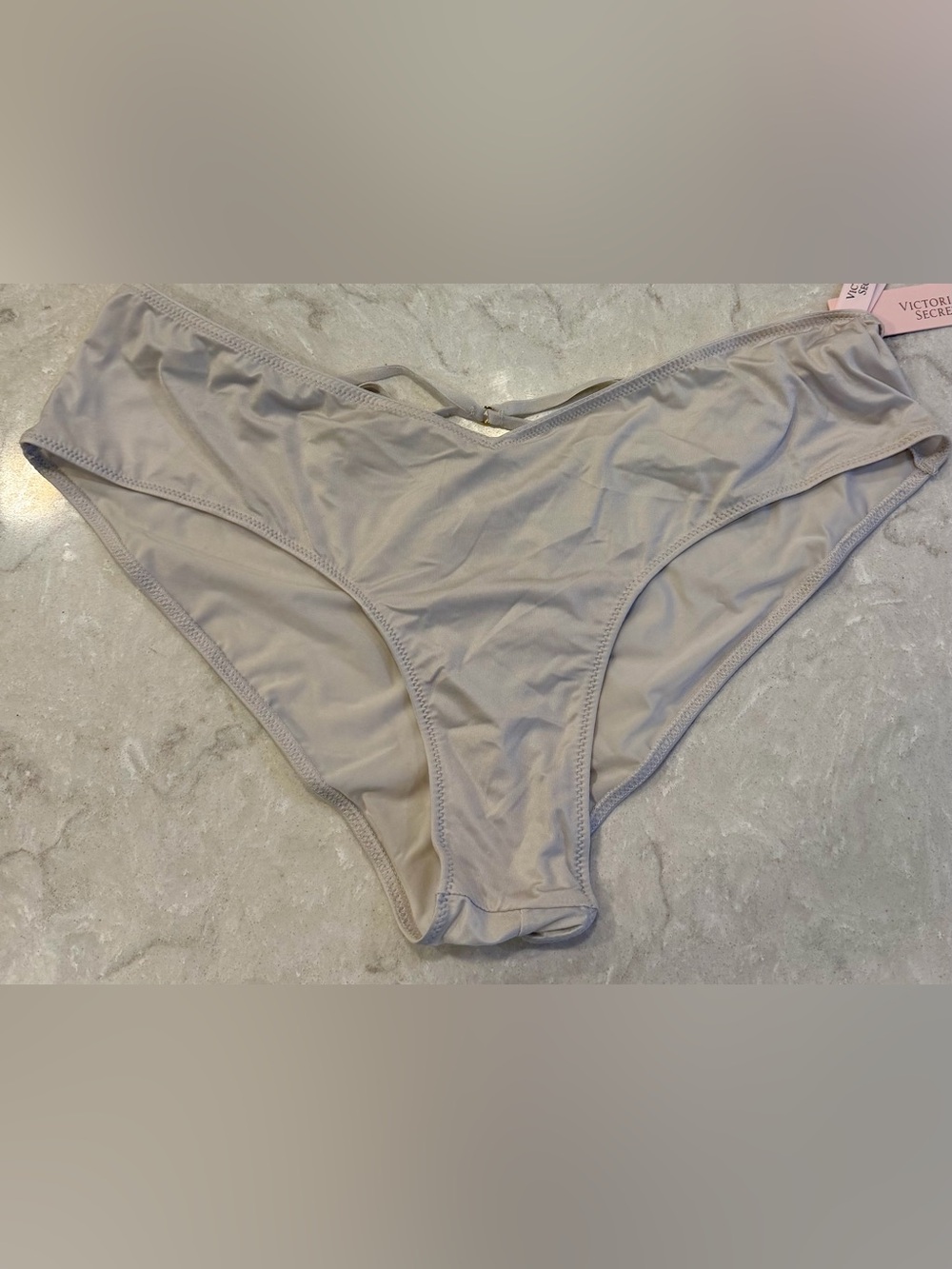 Brand New Victoria's Secret panties in a light gray with strings in the back
